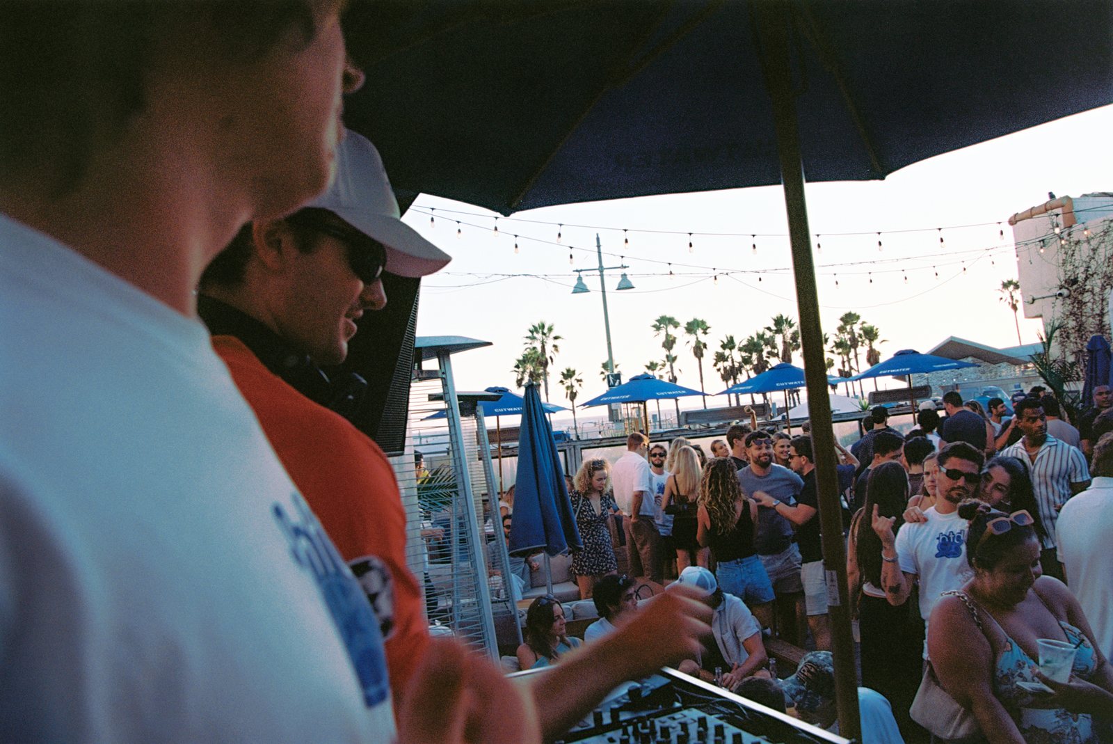 Beneath the Decks crowd at sunset